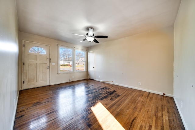 foyer featuring ceiling fan and dark wood-type flooring