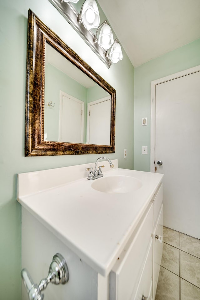 bathroom with tile patterned floors and vanity