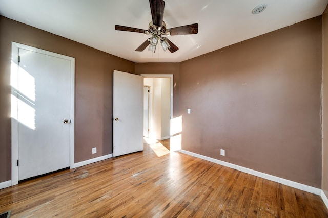 unfurnished bedroom with light hardwood / wood-style floors and ceiling fan