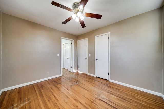 unfurnished bedroom featuring ceiling fan and light hardwood / wood-style floors