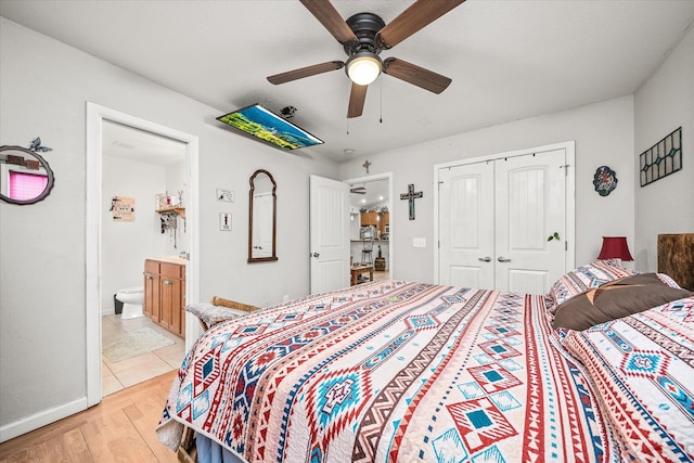 bedroom featuring a closet, ceiling fan, light hardwood / wood-style flooring, and ensuite bathroom