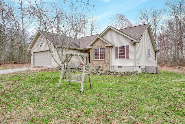 view of front of house featuring a garage and a front lawn