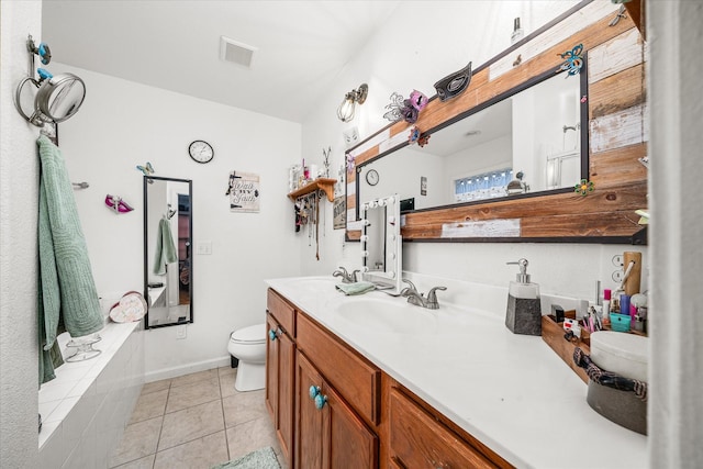 bathroom featuring tile patterned floors, vanity, and toilet