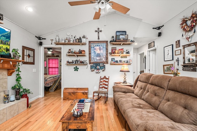 living room featuring light hardwood / wood-style flooring and lofted ceiling