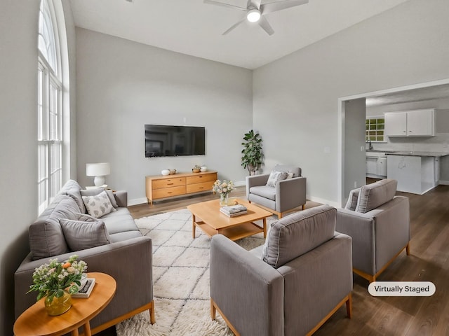 living room featuring ceiling fan, a healthy amount of sunlight, and light hardwood / wood-style floors