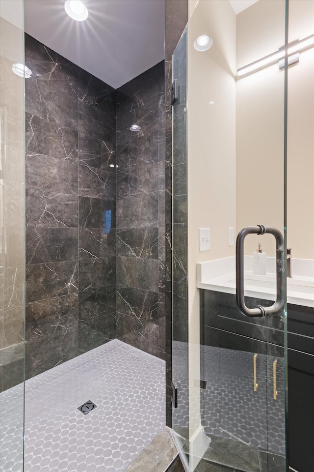 bathroom featuring walk in shower and sink