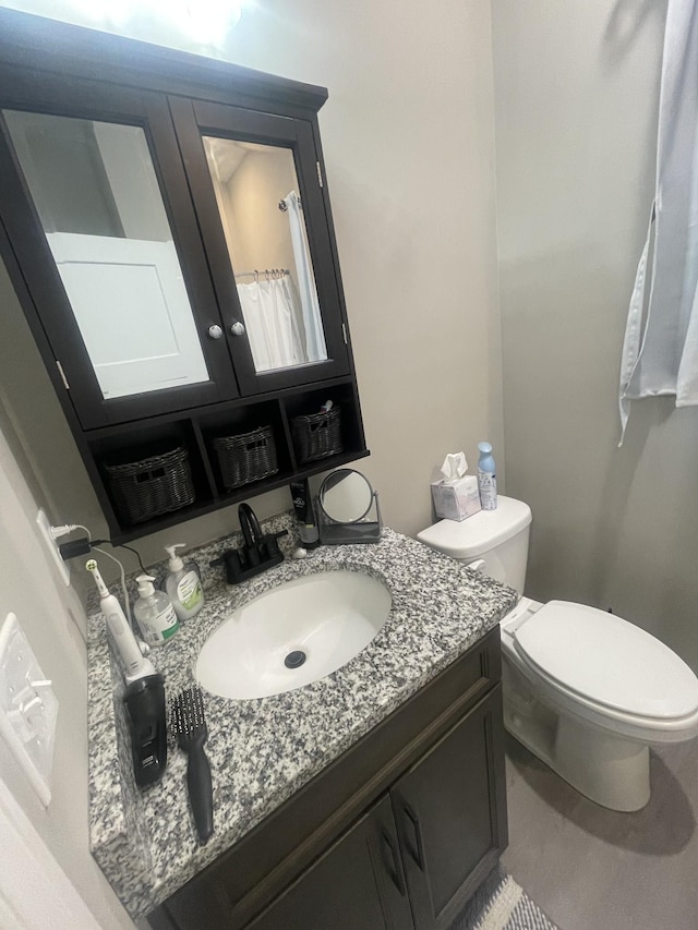 bathroom with vanity and toilet