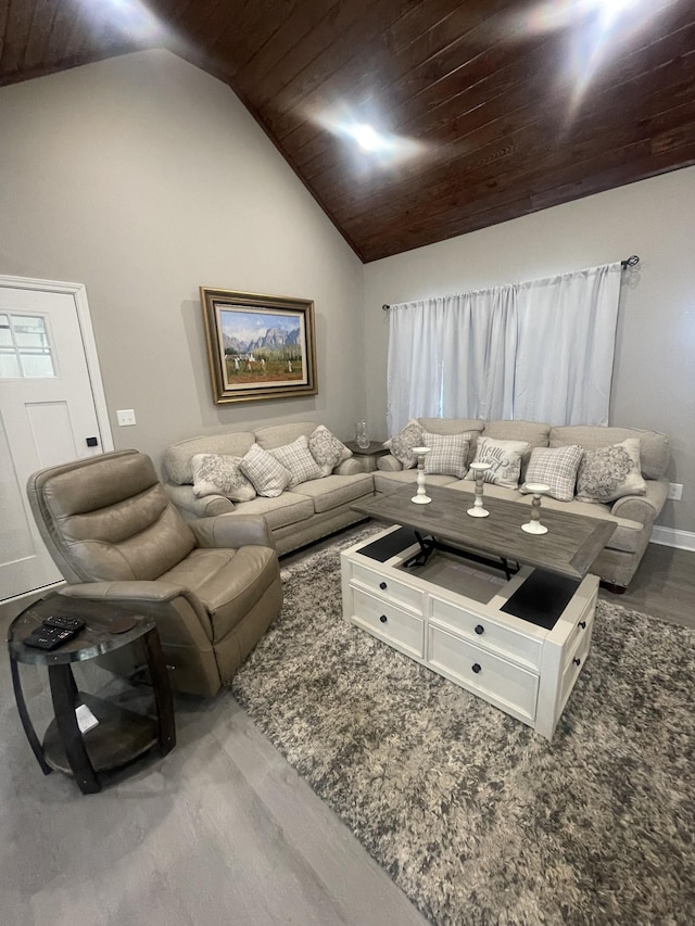 living room featuring hardwood / wood-style floors, wooden ceiling, and lofted ceiling