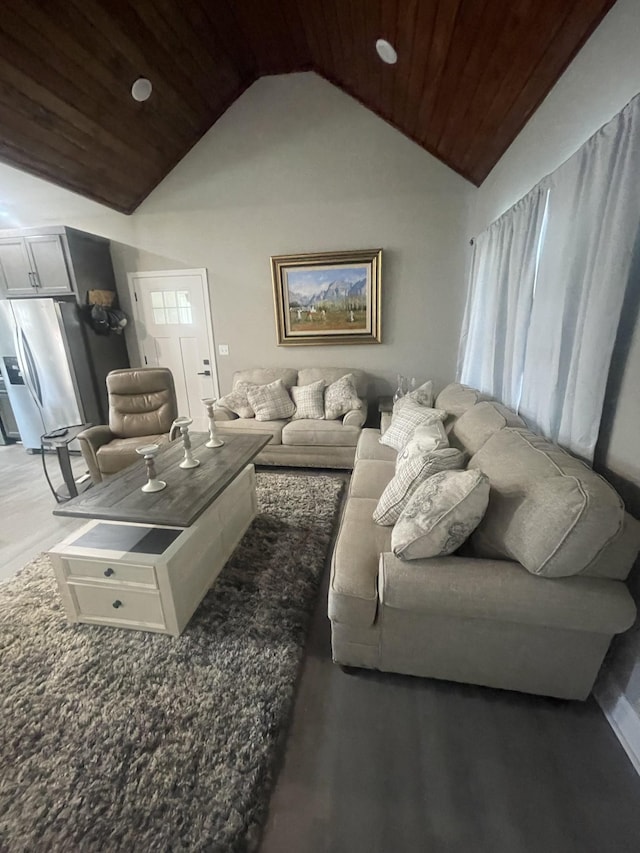 living room with wood ceiling and high vaulted ceiling