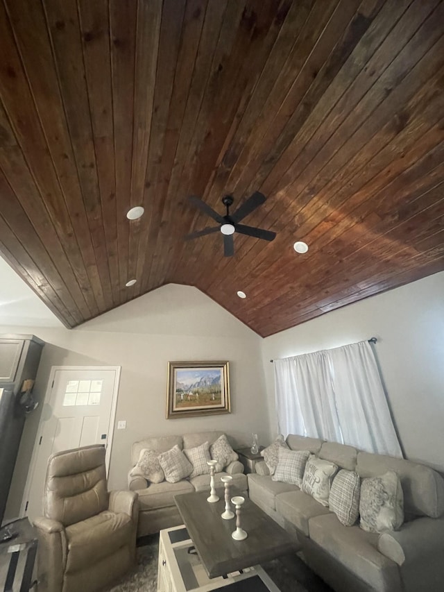 living room featuring vaulted ceiling, ceiling fan, and wood ceiling