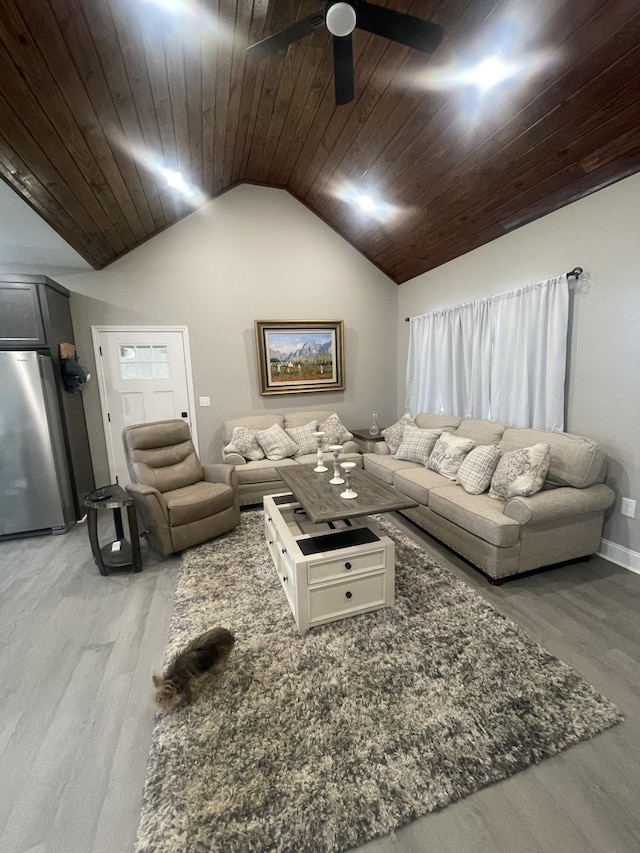 living room with ceiling fan, hardwood / wood-style floors, wooden ceiling, and vaulted ceiling