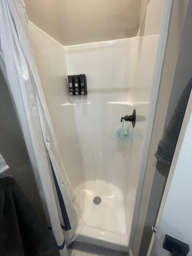 bathroom with a shower with shower curtain