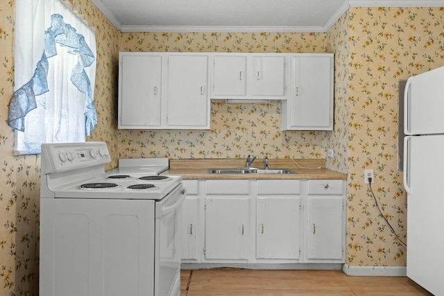 kitchen with white appliances, white cabinets, crown molding, sink, and light wood-type flooring