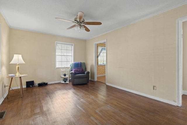 unfurnished room featuring a textured ceiling, ceiling fan, dark hardwood / wood-style flooring, and crown molding