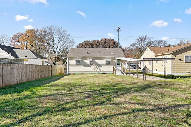 rear view of property with a yard