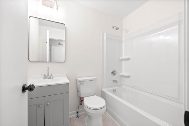 full bathroom with tile patterned flooring, vanity, bathing tub / shower combination, and toilet