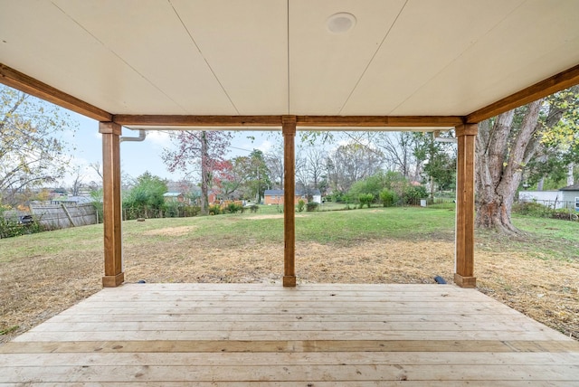 wooden deck featuring a yard