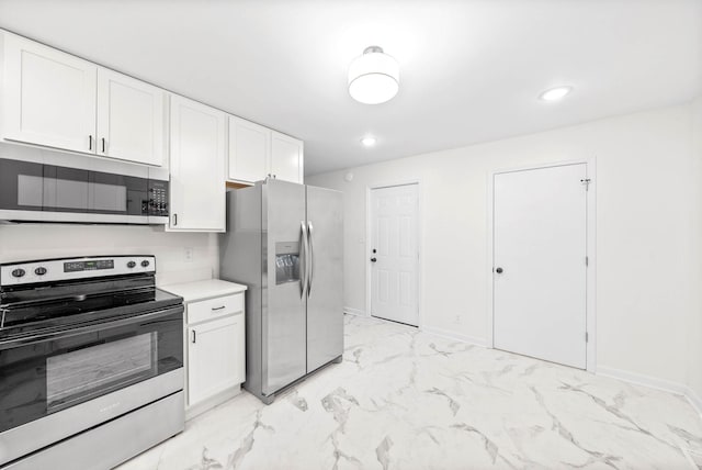 kitchen featuring white cabinets and stainless steel appliances