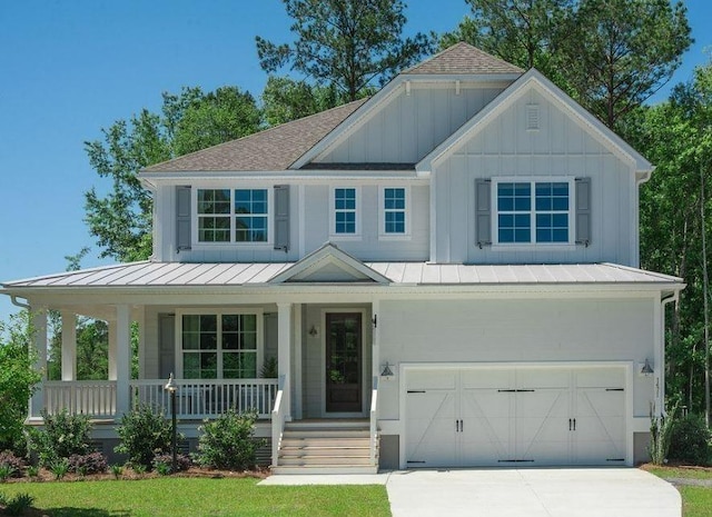 view of front facade with covered porch and a garage