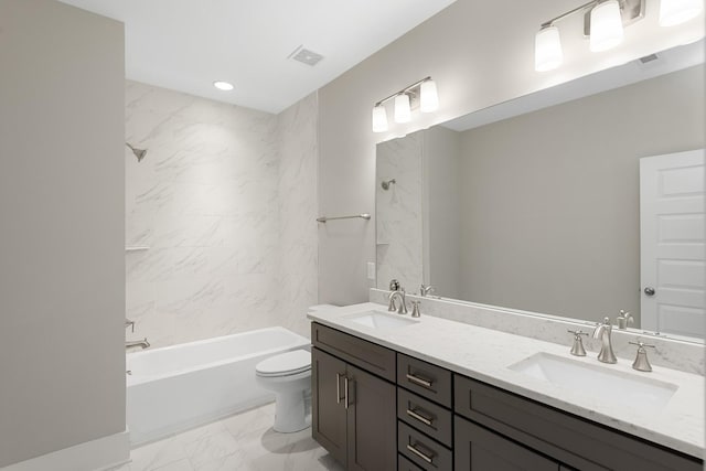 full bathroom featuring vanity, toilet, and tiled shower / bath