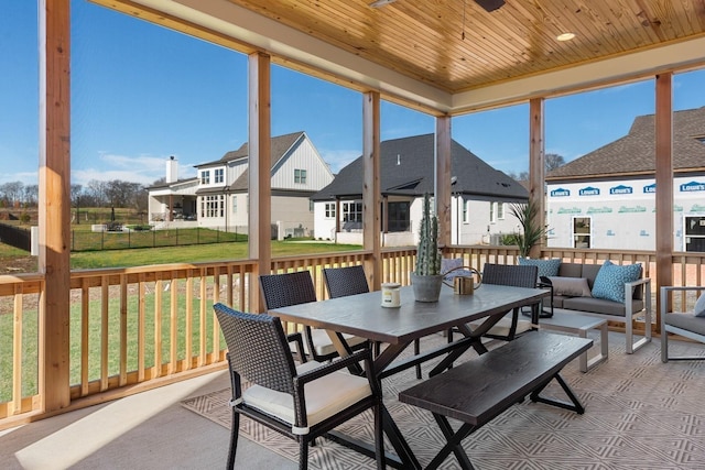 sunroom featuring wood ceiling