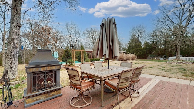 deck featuring an outdoor fireplace