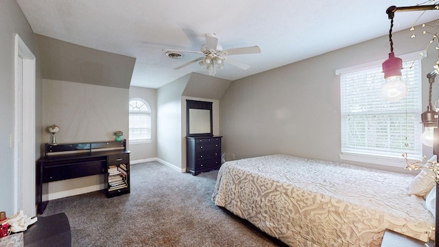 bedroom featuring ceiling fan, dark carpet, and vaulted ceiling