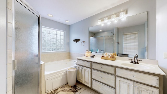 bathroom featuring tile patterned floors, vanity, and plus walk in shower