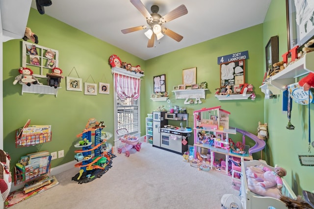 game room featuring ceiling fan and carpet