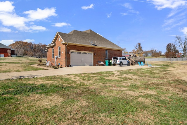 view of property exterior featuring a lawn and a garage