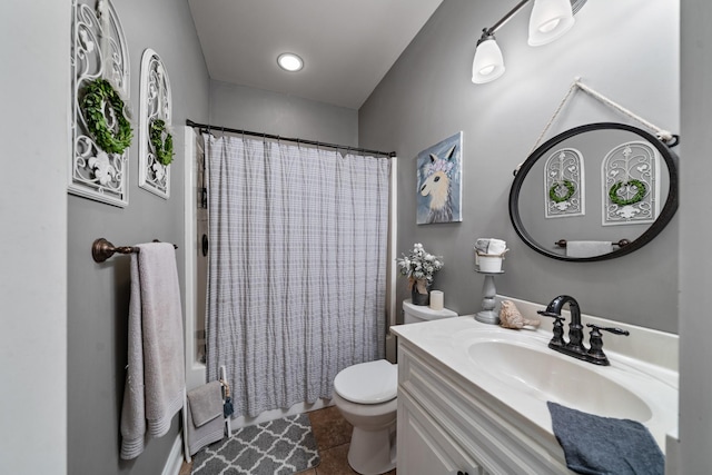 full bathroom featuring tile patterned floors, vanity, toilet, and shower / bath combo with shower curtain