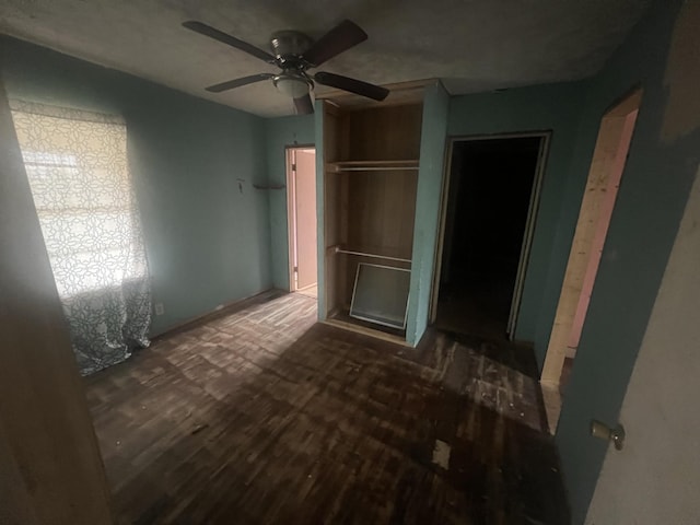 bedroom featuring ceiling fan and dark hardwood / wood-style floors