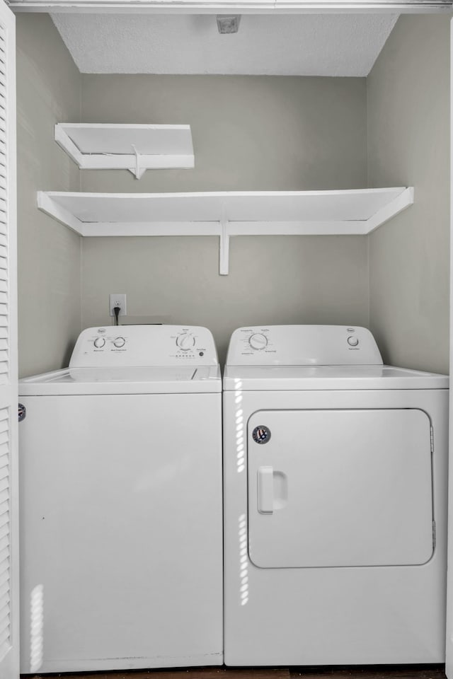 laundry room with laundry area and washer and clothes dryer