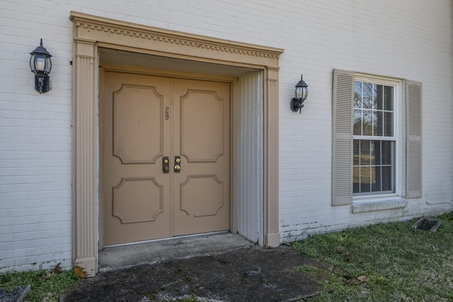 entrance to property with brick siding