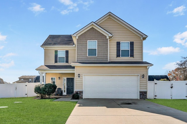 view of front of property featuring a front yard and a garage