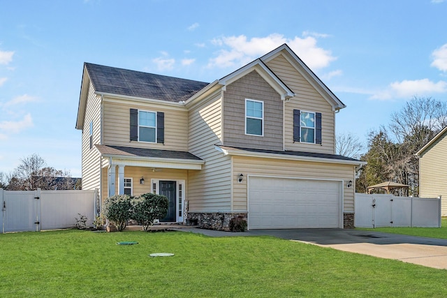 craftsman-style home featuring a garage and a front lawn