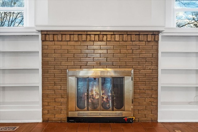 room details featuring a brick fireplace