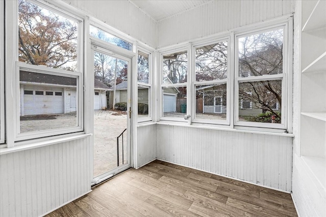 unfurnished sunroom with plenty of natural light