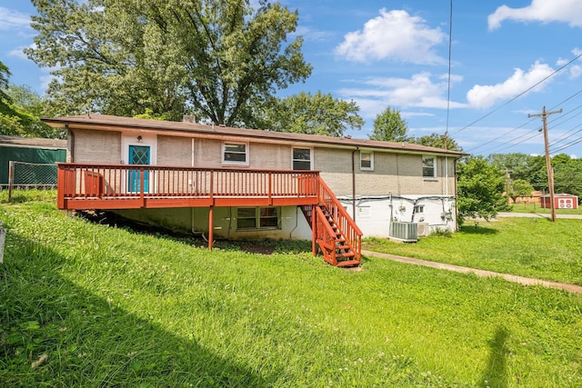 rear view of house featuring central AC, a yard, and a deck