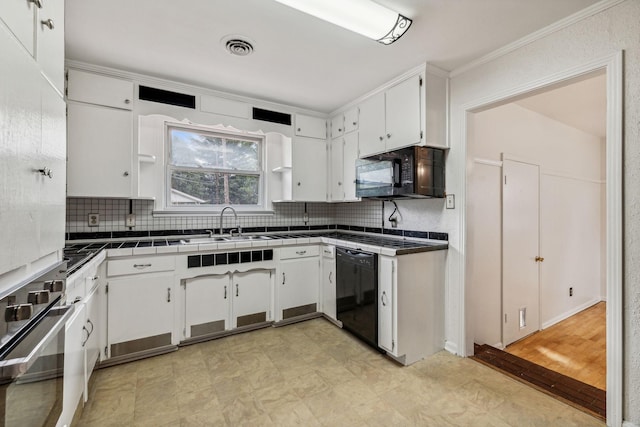 kitchen featuring tile countertops, white cabinets, black appliances, and light wood-type flooring