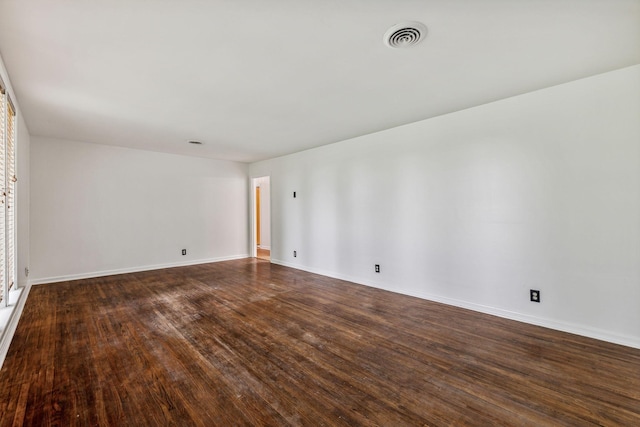 empty room featuring dark hardwood / wood-style floors