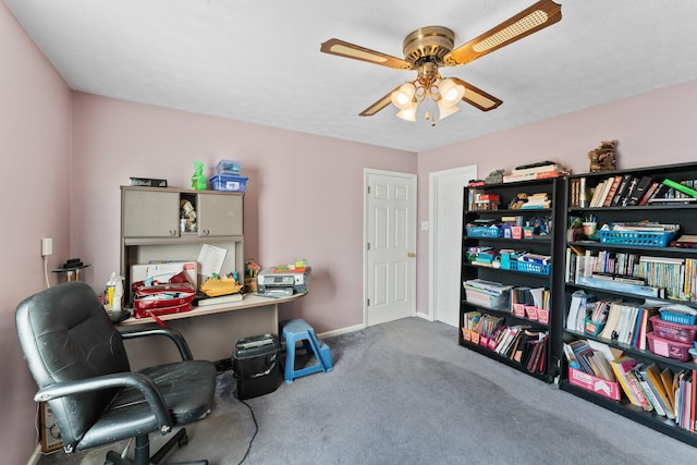 office space with ceiling fan, carpet floors, and a textured ceiling