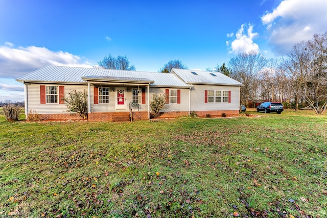 single story home with covered porch and a front lawn