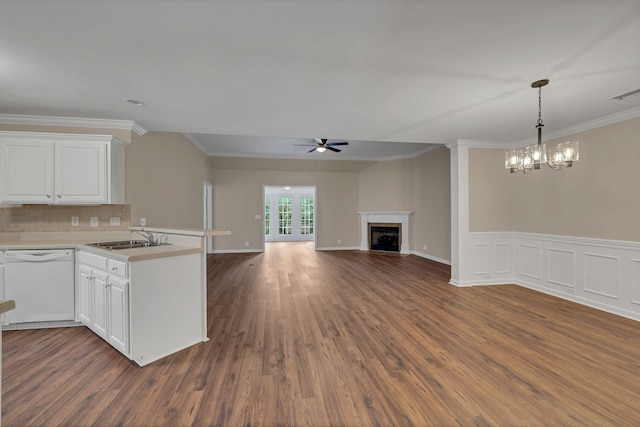 kitchen featuring dark hardwood / wood-style flooring, white dishwasher, white cabinetry, and sink