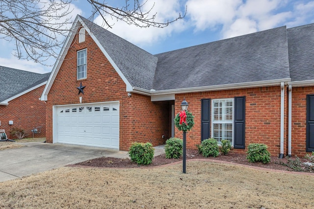 view of front facade with a garage and a front yard