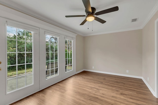 unfurnished room featuring ceiling fan, ornamental molding, and light hardwood / wood-style flooring