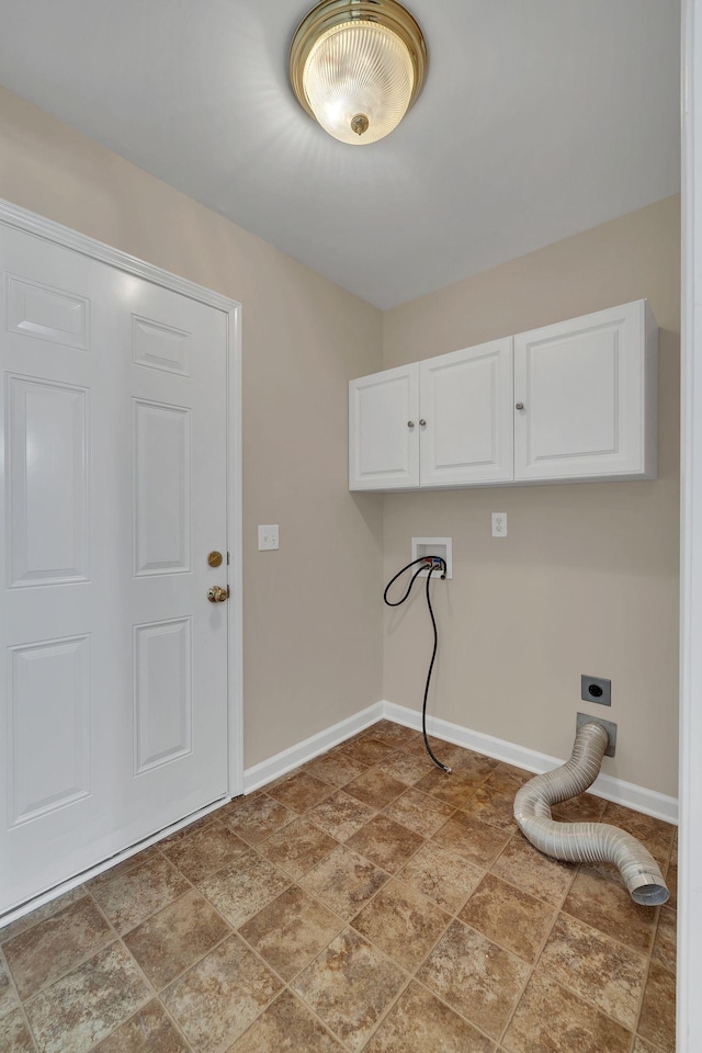 laundry area featuring electric dryer hookup and cabinets