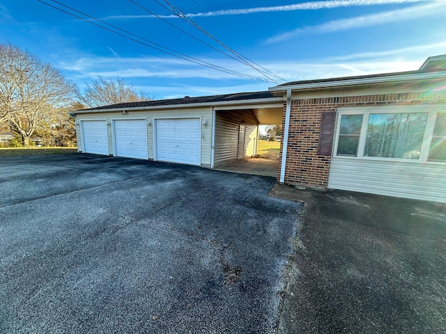 garage with a carport