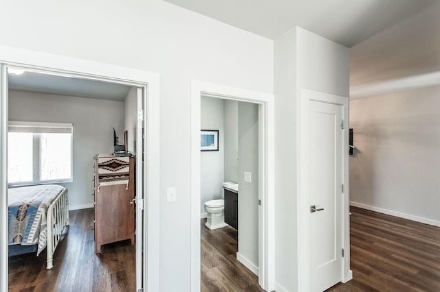 corridor featuring dark hardwood / wood-style flooring