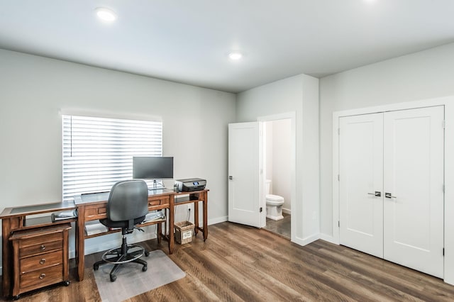 home office featuring dark hardwood / wood-style flooring